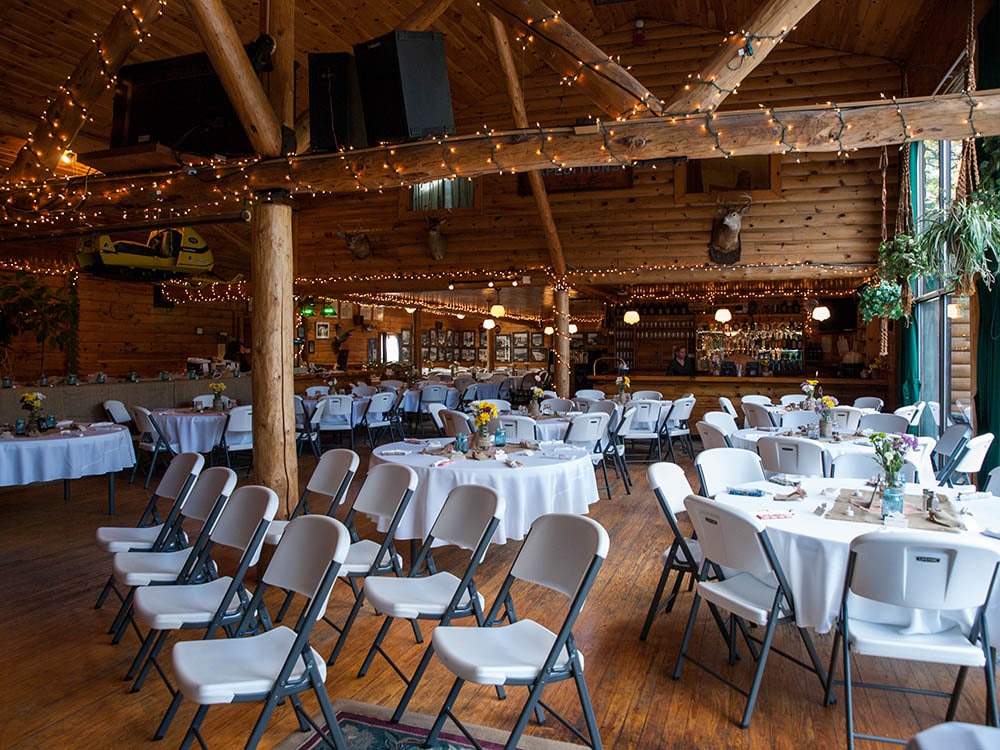rustic lodge wedding Maine - ceremony and reception decorated with lights