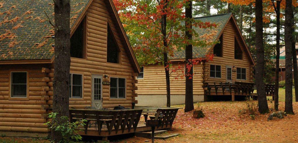 Cabins in the woods with fall foliage in Maine