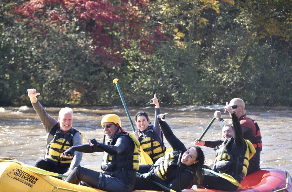 Smiling rafters on the Dead River Rafting trip in 2025